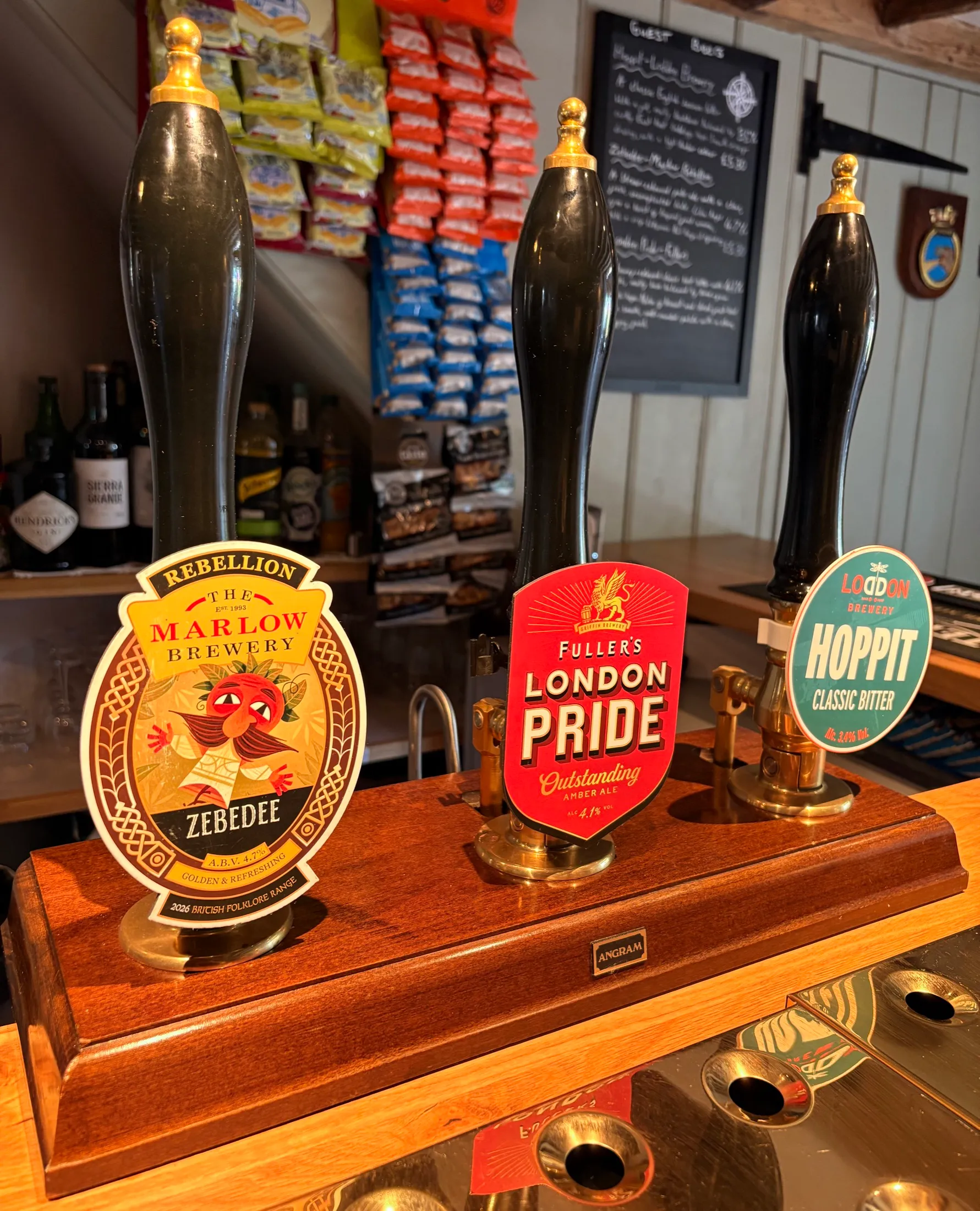 Three cask hand pumps at The Old Ship with clips for Rebellion Zebedee, Fuller's London Pride and Loddon Hoppit
