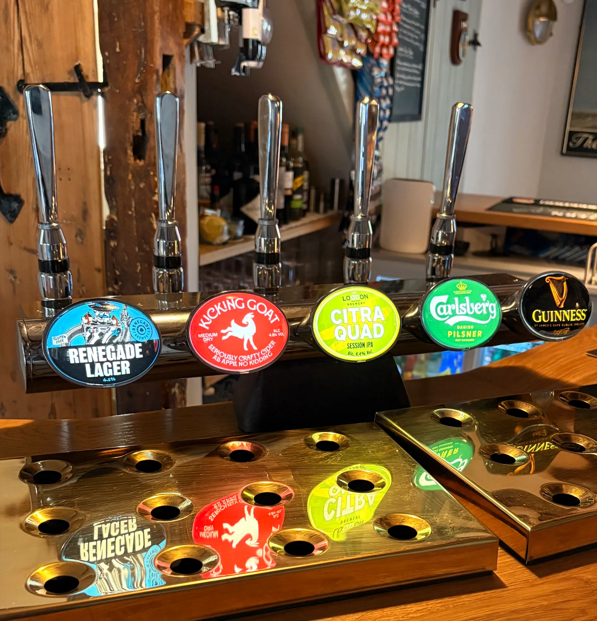 The Old Ship's tap font pouring Renegade lager, Kicking Goat cider, a session IPA, Carlsberg and Guinness